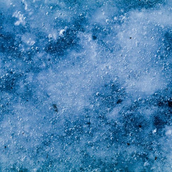 Abstract ice blue spheres representing cellular energy and muscle tone